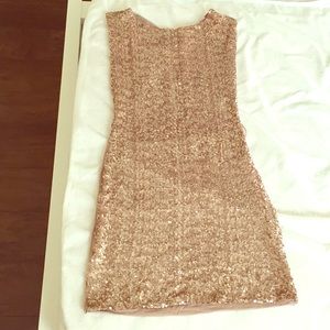 Gold sequin dress with an open back